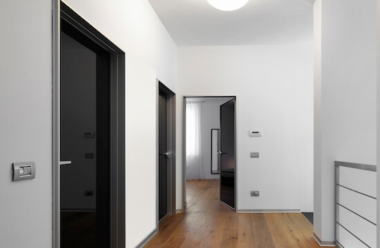 puertas de seguridad medellin modern corridor with several doors and wooden floor